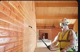 Providing and applying two coats of fire retardant paint on cleaned wood / ply surface @ 3.5 sqm per litre per coat including preparation of base surface as per recommendations of manufacturer to make the surface fire retardant