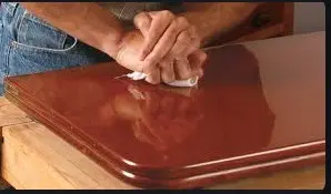 French spirit polishing Two or more coats on new works including a coat of wood filler