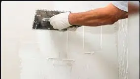 Providing and applying white cement based putty of average thickness 1 mm, of approved brand and manufacturer, over the plastered wall surface to prepare the surface  even and smooth complete