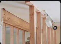 Providing joists (karries) including hoisting, fixing in position and applying wood preservative on unexposed surface etc. complete with Sal wood