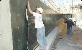 Providing and laying integral cement based treatment for water proofing on the
vertical surface by fixing specified stone slab 22 mm to 25 mm thick with cement
slurry mixed with water proofing compound conforming to IS:2645 in recommended
proportions with a gap of 20 mm (minimum) between stone slabs and the receiving
surfaces and filling the gaps with neat cement slurry mixed with water proofing
compound and finishing the exterior of stone slab with cement mortar 1:3 (1 cement
: 3 coarse sand) 20 mm thick with neat cement punning mixed with water proofing
compound in recommended proportion complete at all levels Using rough Kota stone.