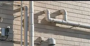 Painting (two or more coats) on rain water, soil, waste and vent pipes and fittings with black anticorrosive bitumastic paint of approved brand and manufacture, over and including a priming of ready mixed zinc chromate yellow primer on new work 150 mm diameter pipes