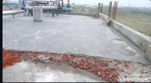 Providing and laying integral cement based water proofing treatment including
preparation of surface as required for treatment of roofs, balconies, terraces etc
consisting of following operations: a) Applying a slurry coat of neat cement using
2.75 kg/ sqm of cement admixed with water proofing compound conforming to IS.
2645 over the RCC slab including adjoining walls upto 300 mm height including cleaning the surface before treatment. b) Laying brick bats with mortar using broken bricks/brick bats 25 mm to 115 mm size with 50% of cement mortar 1:5 (1 cement : 5 coarse sand) admixed with water proofing compound conforming to IS : 2645  over 20 mm thick layer of cement mortar of mix 1:5 (1 cement : 5 coarse sand) admixed with water proofing compound conforming to IS : 2645  to required slope and treating similarly the adjoining walls upto 300 mm height including rounding of junctions of walls and slabs c) After two days of proper curing applying a second coat of cement slurry using 2.75 kg/ sqm of cement admixed with water proofing compound conforming to IS : 2645  d) Finishing the surface with 20 mm thick jointless cement mortar of mix 1:4 (1 cement : 4 coarse sand) admixed with water proofing compound conforming to IS: 2645 including laying glass fibre cloth of approved quality in top layer of plaster and finally finishing the surface
with trowel with neat cement slurry and making pattern of 300x300 mm square 3 mm deep. e) The whole terrace so finished shall be flooded with water for a minimum
period of two weeks for curing and for final test. With average thickness of 120 mm and minimum thickness at khurra as 65 mm