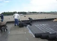 Providing and laying APP (Atactic Polypropylene Polymer) modified prefabricated
five layer 3 mm thick water proofing membrane, black finished reinforced with
non-woven polyester matt consisting of a coat of bitumen primer for bitumen
membrane @ 0.40 litre/ sqm by the same membrane manufacture of density at
25°C, 0.87-0.89 kg/ litre and viscocity 70-160 cps. Over the primer coat the layer of
membrane shall be laid using Butane Torch and sealing all joints etc., and preparing
the surface complete. The vital physical and chemical parameters of the membrane
shall be as under : Joint strength in longitudinal and transverse direction at 23°C
as 650/450N/5 cm. Tear strength in longitudinal and transverse direction as 300/
250N. Softening point of membrane not less than 150°C. Cold flexibility shall be
upto -2°C when tested in accordance with ASTM, D - 5147. The laying of membrane
shall be got done through the authorised applicator of the manufacturer of
membrane. 3 mm thick